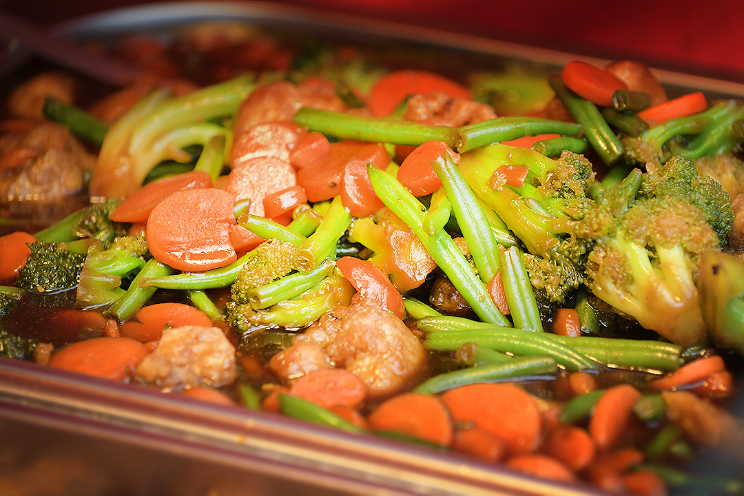 Peppers in a dish on a stall selling grocery foods